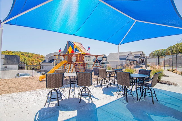 view of patio featuring a playground