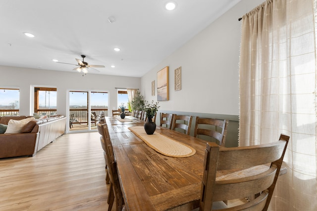 dining area featuring light wood-type flooring and ceiling fan