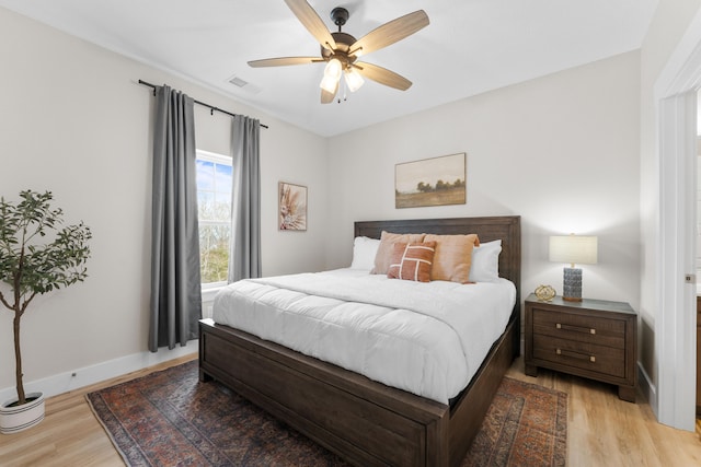 bedroom featuring light wood-type flooring and ceiling fan