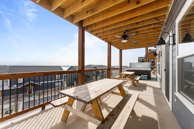 exterior space featuring a jacuzzi and ceiling fan