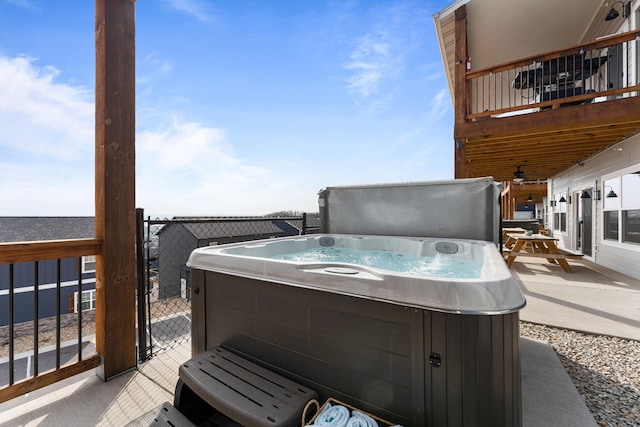 deck featuring a hot tub