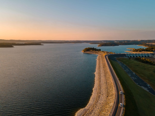 aerial view at dusk with a water view