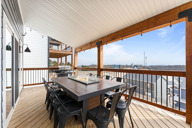 deck featuring a grill