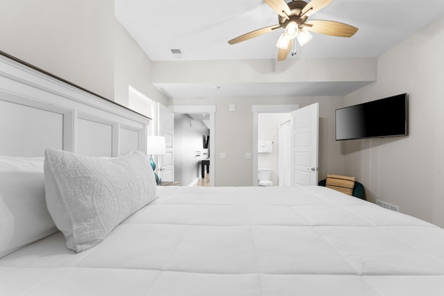 bedroom with ceiling fan and connected bathroom