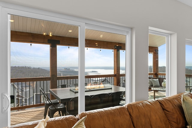 sunroom / solarium with a water view