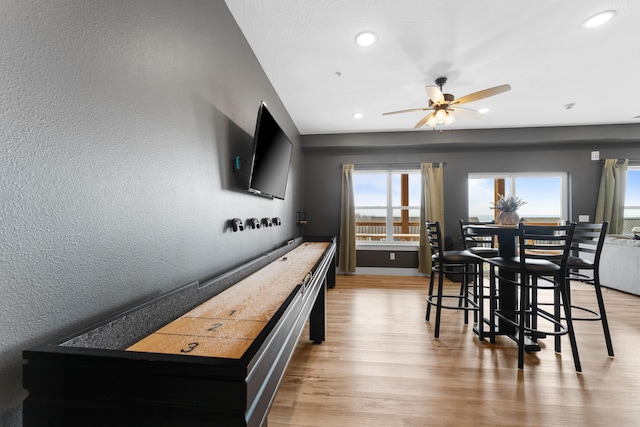 interior space featuring light wood-type flooring and ceiling fan