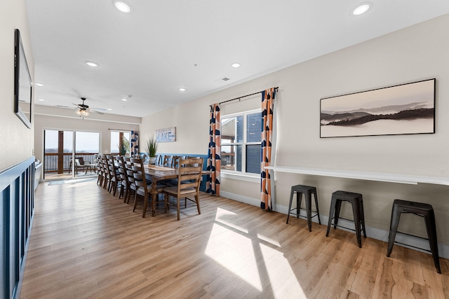 dining room with ceiling fan, light hardwood / wood-style flooring, and plenty of natural light