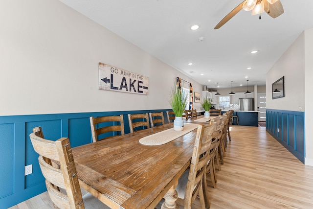 dining area featuring ceiling fan and light hardwood / wood-style floors