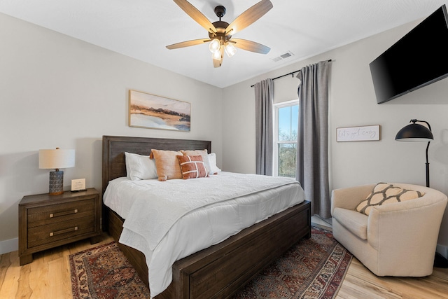 bedroom featuring light wood-type flooring and ceiling fan