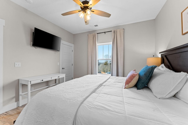 bedroom featuring light wood-type flooring and ceiling fan