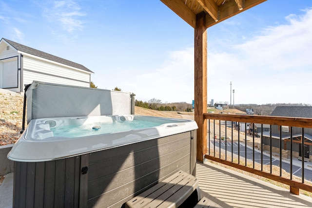 wooden terrace with a hot tub