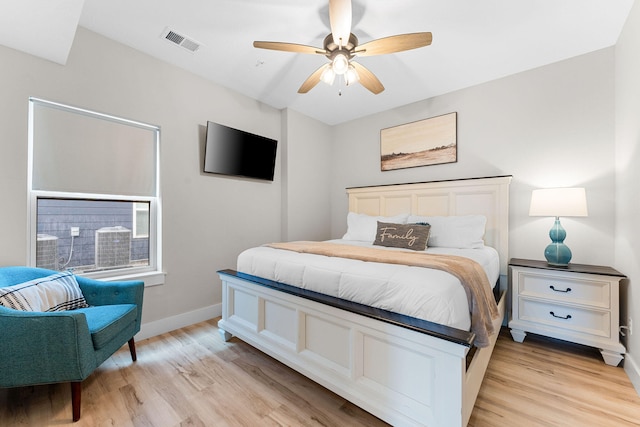 bedroom with ceiling fan and light hardwood / wood-style floors