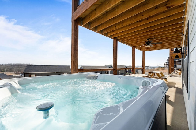 view of pool featuring ceiling fan and a hot tub