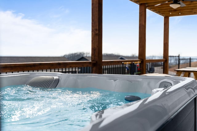 deck featuring a hot tub