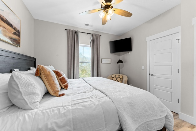 bedroom featuring light wood-type flooring and ceiling fan