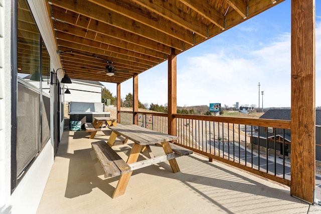 view of patio / terrace featuring a deck and ceiling fan