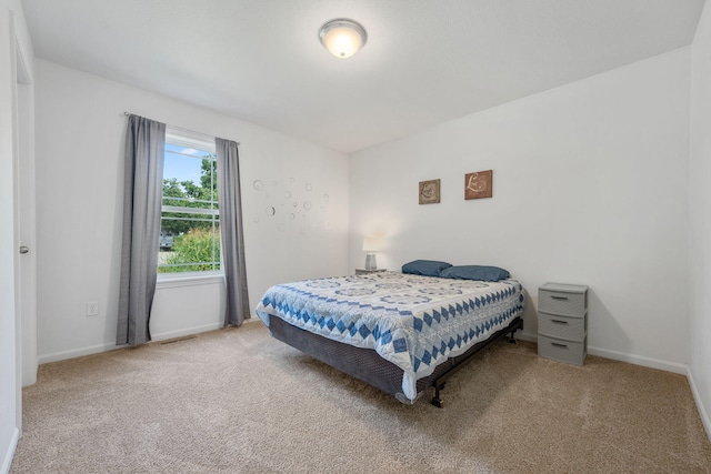 bedroom with light carpet