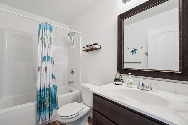 full bathroom with hardwood / wood-style floors, toilet, shower / bath combo, and vanity