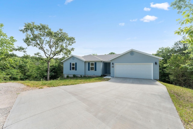 200 Apostle Rd, Reeds Spring, MO 65737 - ranch-style home with a garage and driveway