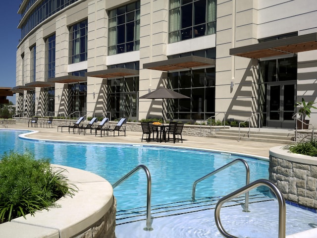 view of pool featuring a patio area