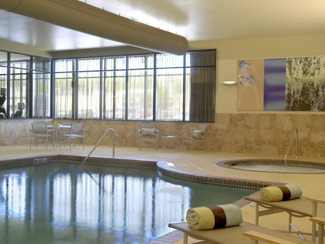 view of pool featuring an indoor hot tub