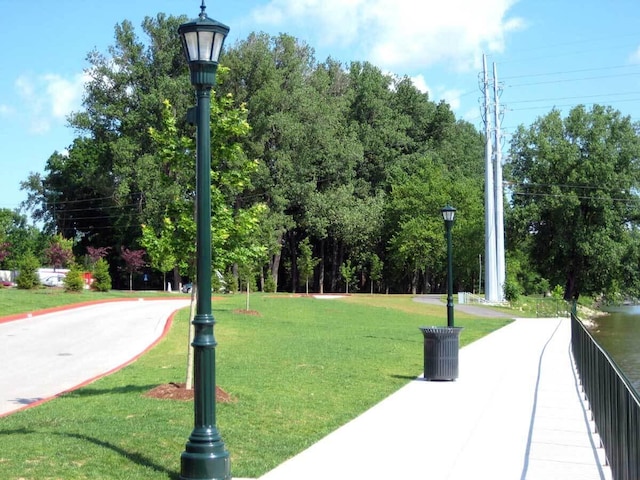 view of property's community with a lawn