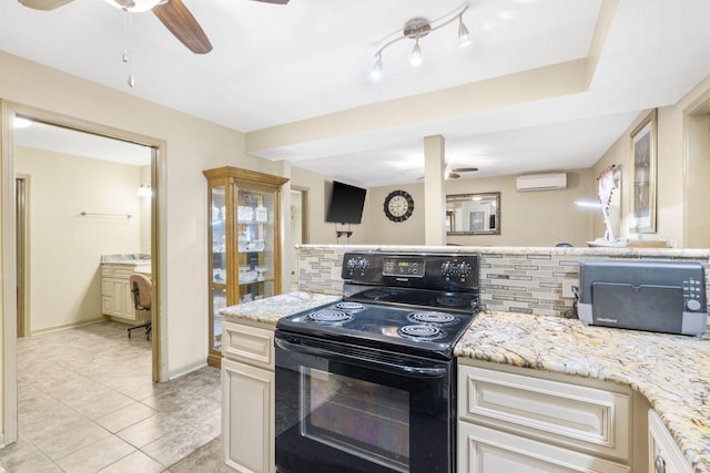 kitchen featuring a wall mounted air conditioner, black electric range oven, decorative backsplash, ceiling fan, and light tile patterned floors