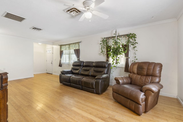 living room with ceiling fan, light hardwood / wood-style flooring, and ornamental molding