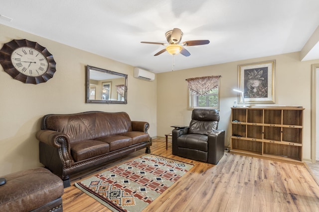 living room featuring hardwood / wood-style floors, a ceiling fan, and a wall unit AC