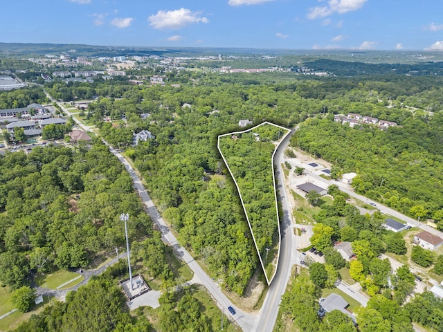 aerial view featuring a wooded view
