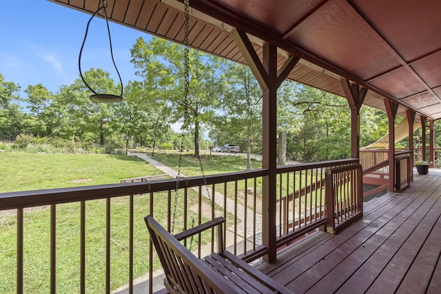 wooden deck with a yard