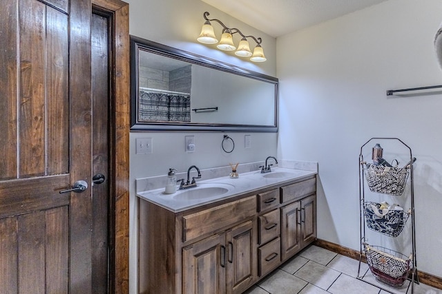 7084 Logan Rd, Hartville, MO 65667 - full bath with tile patterned flooring, baseboards, a sink, and double vanity