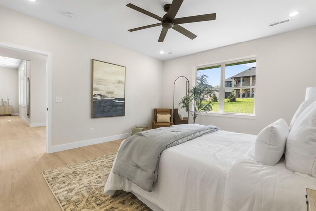 bedroom featuring ceiling fan and light hardwood / wood-style flooring