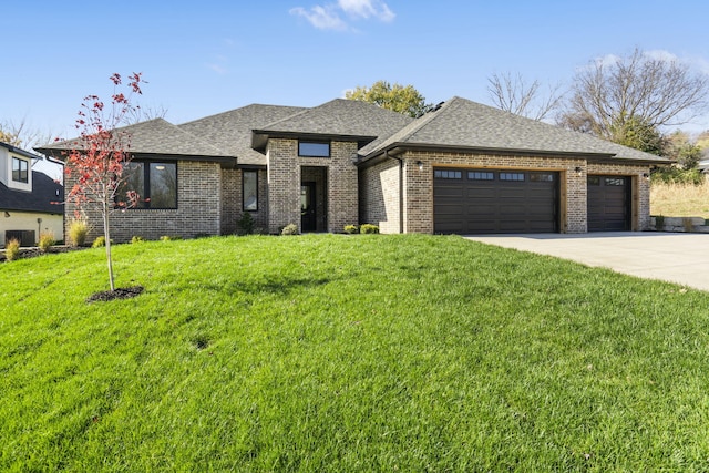 prairie-style home with central air condition unit, a garage, and a front yard