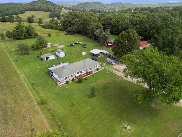 birds eye view of property with a rural view