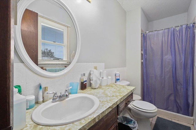 bathroom with tile walls, walk in shower, vanity, and toilet