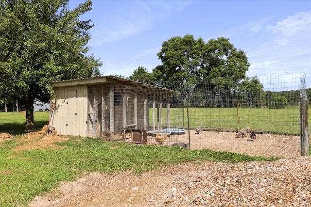 view of outbuilding with a lawn