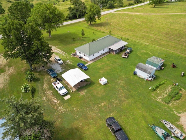 birds eye view of property featuring a rural view