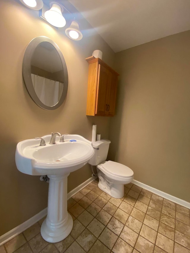 bathroom featuring toilet