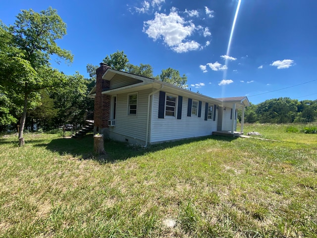 view of property exterior with a yard