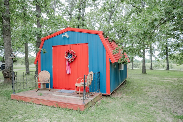 view of outbuilding featuring a yard