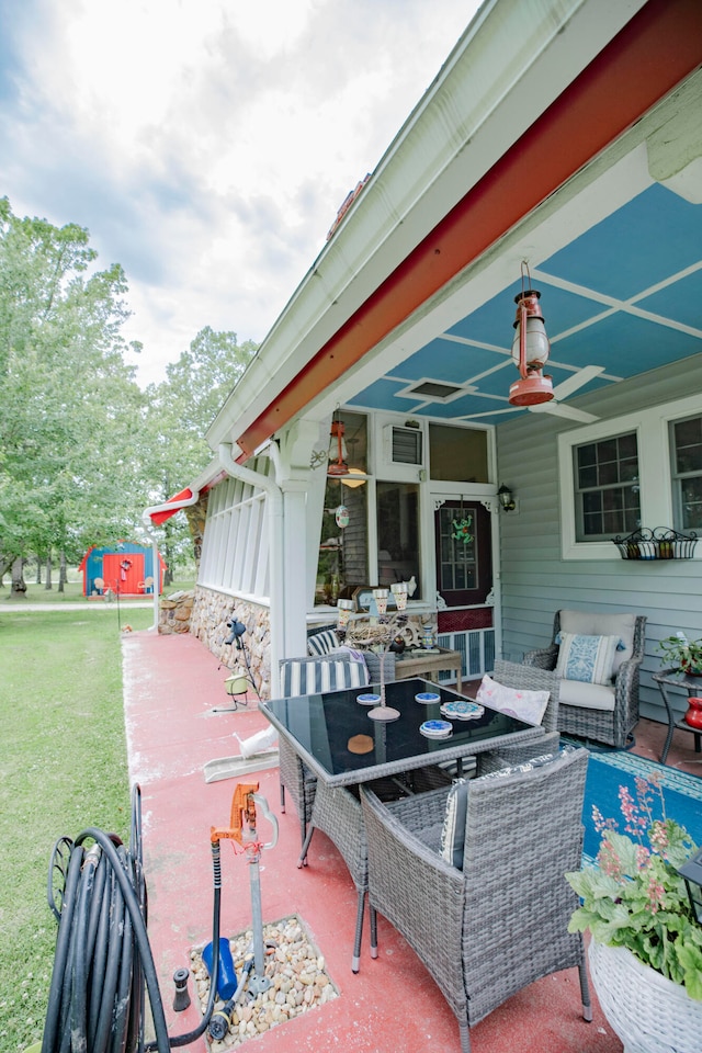 view of patio / terrace featuring ceiling fan