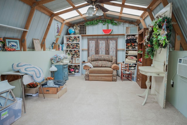 interior space featuring ceiling fan, carpet flooring, and lofted ceiling with beams