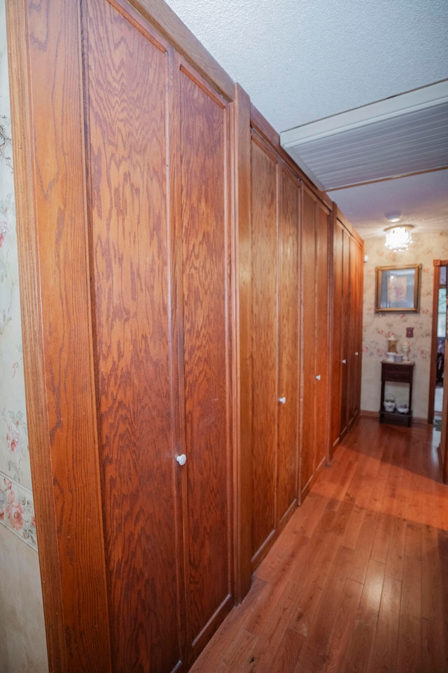 corridor featuring hardwood / wood-style floors