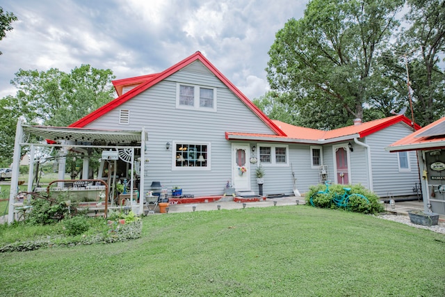 back of house with a yard