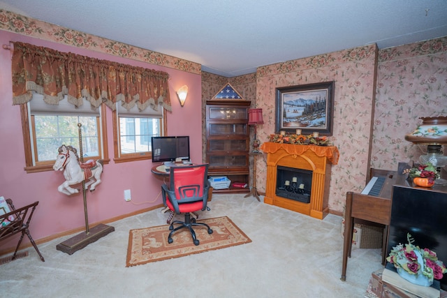 carpeted home office with a textured ceiling