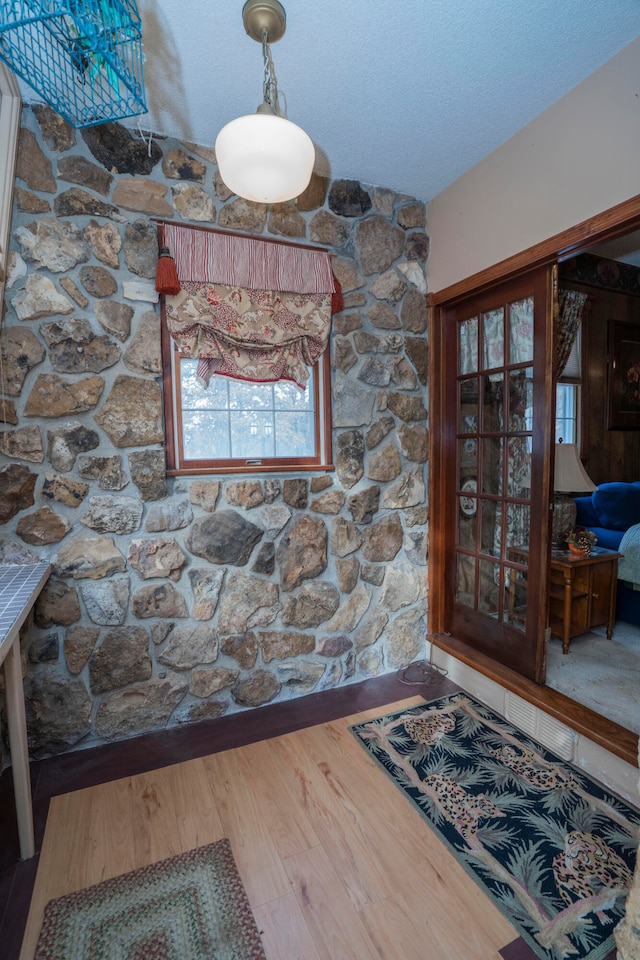 interior space with hardwood / wood-style floors and a textured ceiling