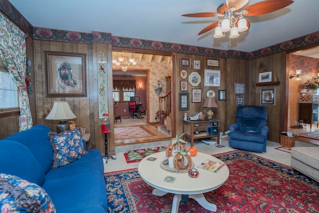 living room with wood walls and ceiling fan