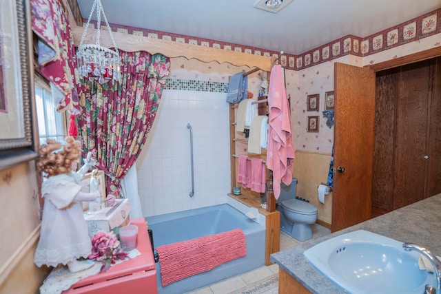 bathroom featuring toilet, vanity, and tile patterned flooring