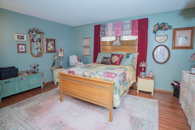 bedroom with light wood-type flooring